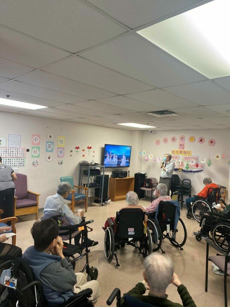 a group of people watch a singing performance